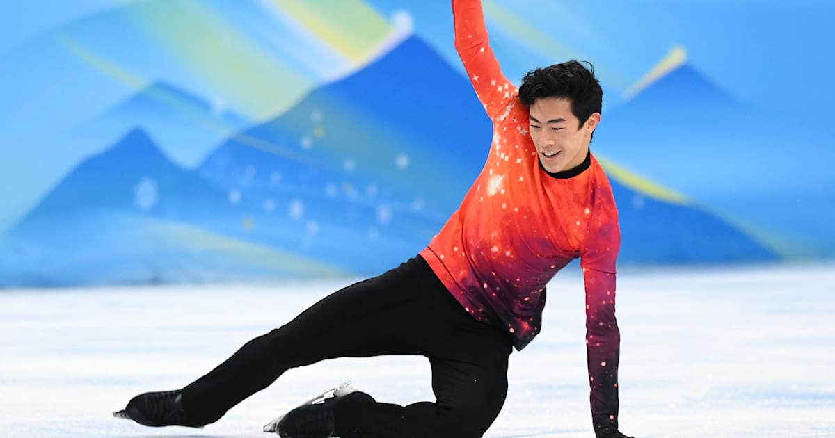 Evan Lysacek celebrates Nathan Chen's gold medal winning moment at