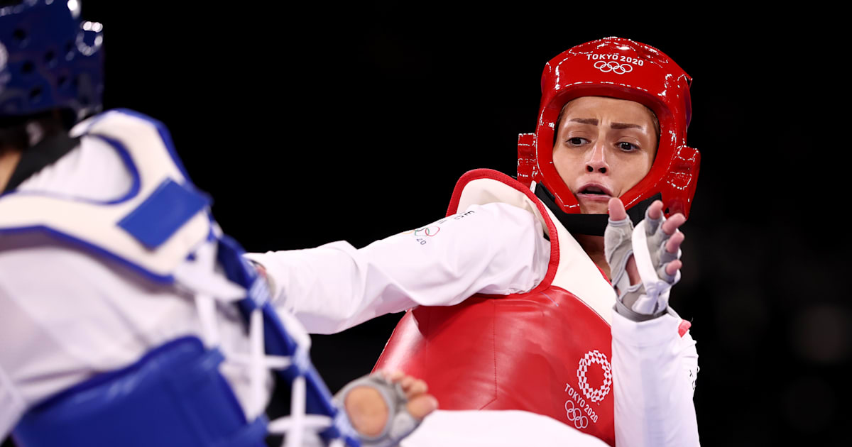 Refugee athlete Dina Pouryounes Langeroudi is beaten by Guo Qing in the women’s taekwondo competition up to 49 kg at the 2024 Olympic Games in Paris