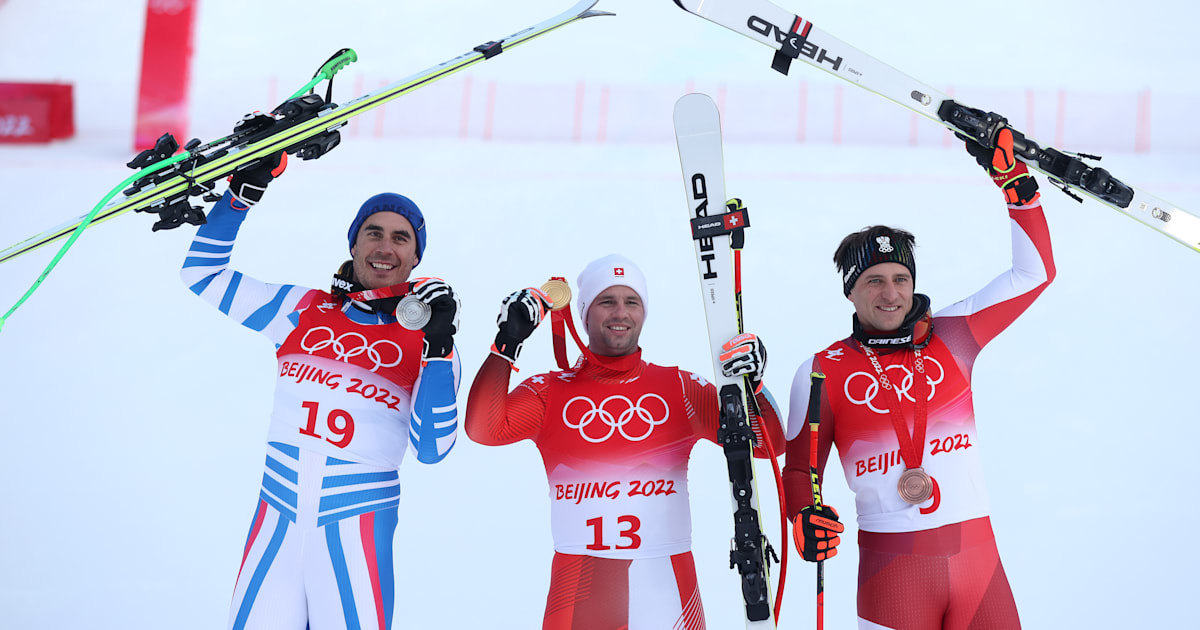 Alpine skiers receive medals on course at Beijing 2022