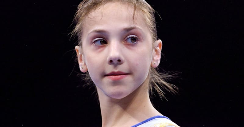 Team Romania performs on the beam during the women's team final at ...