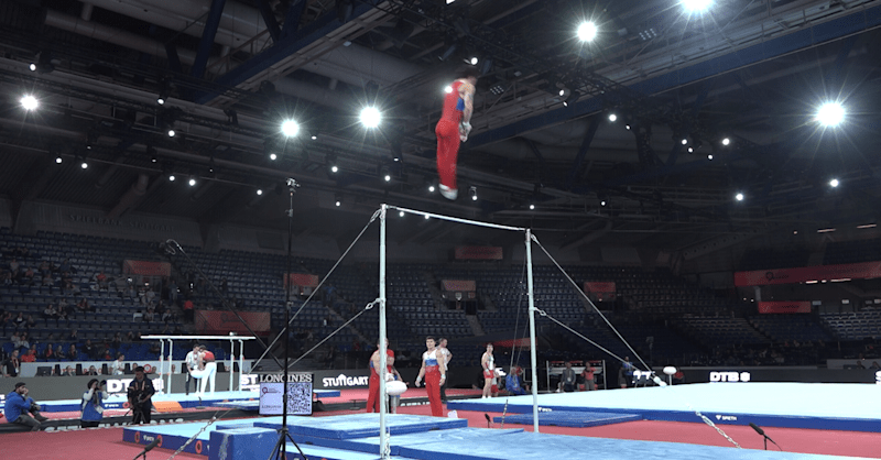 Russian men on horizontal bar in podium training